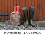 Child And Adult Wellies Outdoors