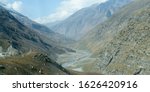 Small photo of V-shaped Himalayas valley down which a river with a winding course flows. An interlocking overlapping spur hill ridges V-shaped valley that extends into a concave bend from opposite side of riverbank.