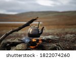 Small Kettle Is Heated On A...