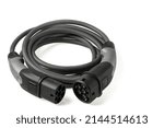 Close up view of black electric vehicle charging cable for outdoor use with 3-phase 20A 480V plug isolated on white background. Sweden.