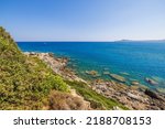 Beautiful view of rocky coast on turquoise water background in Mediterranean sea. Greece.