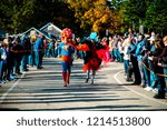 Small photo of Ogunquit, Maine USA: October 21st, 2018: Two participants compete in the Ogunquit High Heel Dash in support of the Frannie Peabody Center.