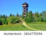 Lookout wooden tower for tourists on the top of the Luban peak in Gorce mountains, Poland