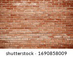 Old red brick wall background texture close up