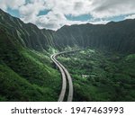 Small photo of Aerial view of Oahu highway between the mountain of Hawaii. Road to Heaven.