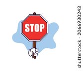 cartoon hand holding a stop... | Shutterstock .eps vector #2066930243