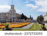 Small photo of KEMEROVO, RUSSIA - JULY 23, 2022:Soviet Square in the historical central part of the capital of Kuzbass.Flower bed on the square of the Soviets. View of the post office and City Hall