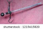 Small photo of Antique hand scale of a market trader, which works according to the lever principle and the moment equilibria.