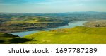 A view of the rolling hills in the Columbia Hills State Park with the columbia river and city of the Dalles in background.   It is a Washington state park near Dallesport in Klickitat County