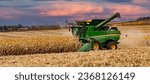 Small photo of Kenyan, Minnesota - 11-2-2019: A combine harvest tine corn in a field near Kenyon, Minnesota. Combine throwing dust and straw in the air.