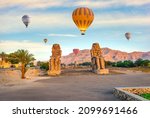 Hot air balloons over Colossi of Memnon in Luxor, Egypt
