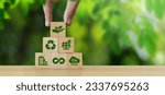 Small photo of ESG Concepts in Environment, Society and Governance Sustainable Organization Development Hand holding a wooden block with green ESG icon on green nature background. copy space