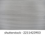 White backgrounds ribbed metal. Thin aluminum fence strips. Horizontal Metal Bars background. Metal fence, detail of a closed metal fence