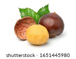Close-up Chestnuts with peeled with green leaves isolated on white background.