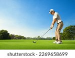 Small photo of Golfer ready tee-off with drivers on golf teeing ground.