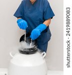 Small photo of Embryologists a Liquid Nitrogen Bank Containing Sperm and Eggs Samples. ivf in vitro fertilization, egg freezing. Sperm cryopreservation. Sperm freezing.