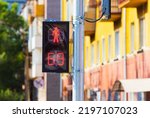 Forbidden pedestrian traffic lights signal. Red light with countdown timer. Time when it is dangerous and you can not cross the road. Stop sign displayed on traffic light