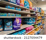 Small photo of Woodinville, WA USA - circa February 2022: Angled, selective focus of the dry and wet cat food aisle inside of a Petsmart store