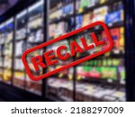 Small photo of Blurry interior of a grocery store aisle behind large red Recall text