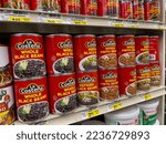 Small photo of Woodinville, WA USA - circa December 2022: Close up view of La Costena canned pean products for sale inside a Haggen grocery store.