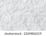 Small photo of Wrinkled or crumpled white stencil paper or tissue after use in toilet or restroom with large copy space is used for background texture in decorative art work.