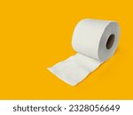 Roll of toilet paper on top on a yellow background for advertising