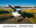 Small sport airplane Cessna 150 on standing on a runway.Single-engine turboprop airplane
