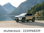Small photo of AUSTRIA, 23. 11.2022: New Toyota Yaris Cross Hybrid of Japanese brand on the road in mountains. Crossover SUV with AWD-I all wheel traction.