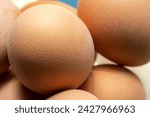 Small photo of Store bought eggs presented up close, macro detail, extreme closeup of an egg shell pores. Raw egg eating safety, salmonella risk, washing eggs, coating concept, nobody. Farm eggs, high quality symbol