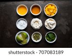 Small photo of selection of ingredients in white ramekins for mango syllabub including fresh fruit, spices, cream and icing sugar