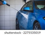 Lima, Peru; March 2020: Lima, Peru; March 2020: Washing car hood BMW with car pressure wash machine.
