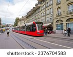 Small photo of Bern, Switzerland-September 21, 2023: City tramcar on Kornhausplatz and riders in Old town
