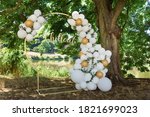 modern wedding arch, inflatable balloons. inscription in gold chillout
