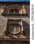Small photo of Carved stone blazon on facade of historical house in the old town of Trujillo, Caceres, Spain