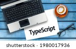 Small photo of TypeScript Programming Language. Word TypeScript on paper and laptop