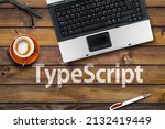 Small photo of TypeScript Programming Language. Word TypeScript on wooden desk and laptop