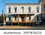 Small photo of Plano, Illinois - United States - September 18th, 2021: Old downtown building in the morning light.