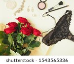 Women's panties, cosmetics, a bouquet of flowers. The concept of female beauty, female happiness. Flat lay.