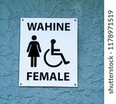 Small photo of A sign for toilets in New Zealand, using the words 'Female' and 'Wahine', the maori word for women.