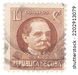 Small photo of CUBA - 1917: An 10 centavos yellow-brown postage stamp showing portrait of Tomas Estrada Palma. Cuban politician, the first President of Cuba