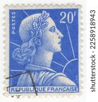 Small photo of FRANCE - 1957: An 20 francs ultramarine postage stamp depicting Marianne and Sun, personification of the French Republic, as a personification of liberty, equality, fraternity