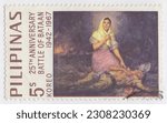 Small photo of PHILIPPINES — 1967 May 15: An 5 sentimos sepia and multicolored postage stamp depicting “Succor” by Fernando Amorsolo. 25th anniversary of the Battle of Bataan