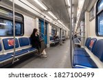Small photo of Moscow. Russia. September 26, 2020. The interior of the half-empty carriage of the Moscow metro before the closure of the metro. Several tired passengers in the carriage return home.