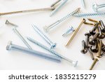 Small photo of Large group of different scows and bolts on the white background