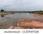 Small photo of Riprap for used to stabilize cut and fill slopes preventing erosion and other stabilization problems. Construction site. Irrigation structure.