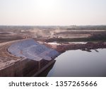 Small photo of Excavation and backfilling of soil work of reservoir. Construction site. Downstream riprap. Irrigation structure.