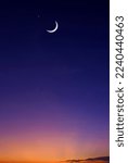 Small photo of Crescent Moon and Star on colorful Dusk Sky in Vertical frame, Beautiful Twilight background with free space for text Ramadan, Eid Al Adha, Mubarak, Eid Al Fitr, Muharram