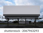 Small photo of Supersize white rectangular advertising billboard on the street at the highway entrance in Boston, Massachusetts.