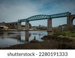 Small photo of Panorama of Boyne viaduct in drogheda spanning over river Boyne in early evening hours. Beautiful pucture of a green metal viaduct and stone arches.