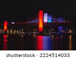 Night view of the Pearl Harbor Memorial Bridge lit up in Red, White and Blue in New Haven, CT